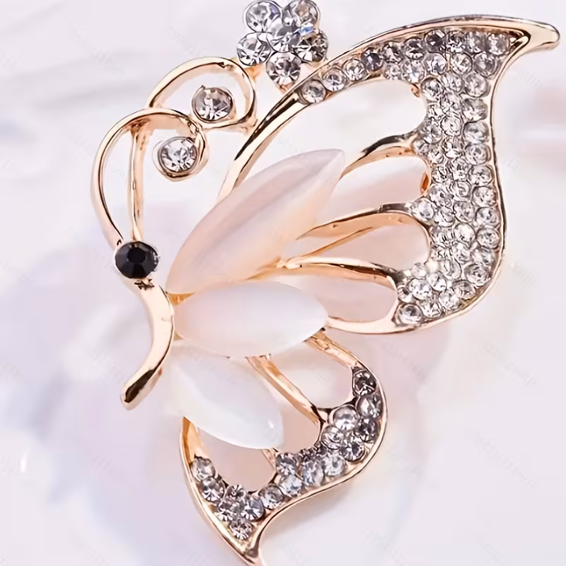 1 elegant Golden butterfly brooch set with sparkling synthetic.